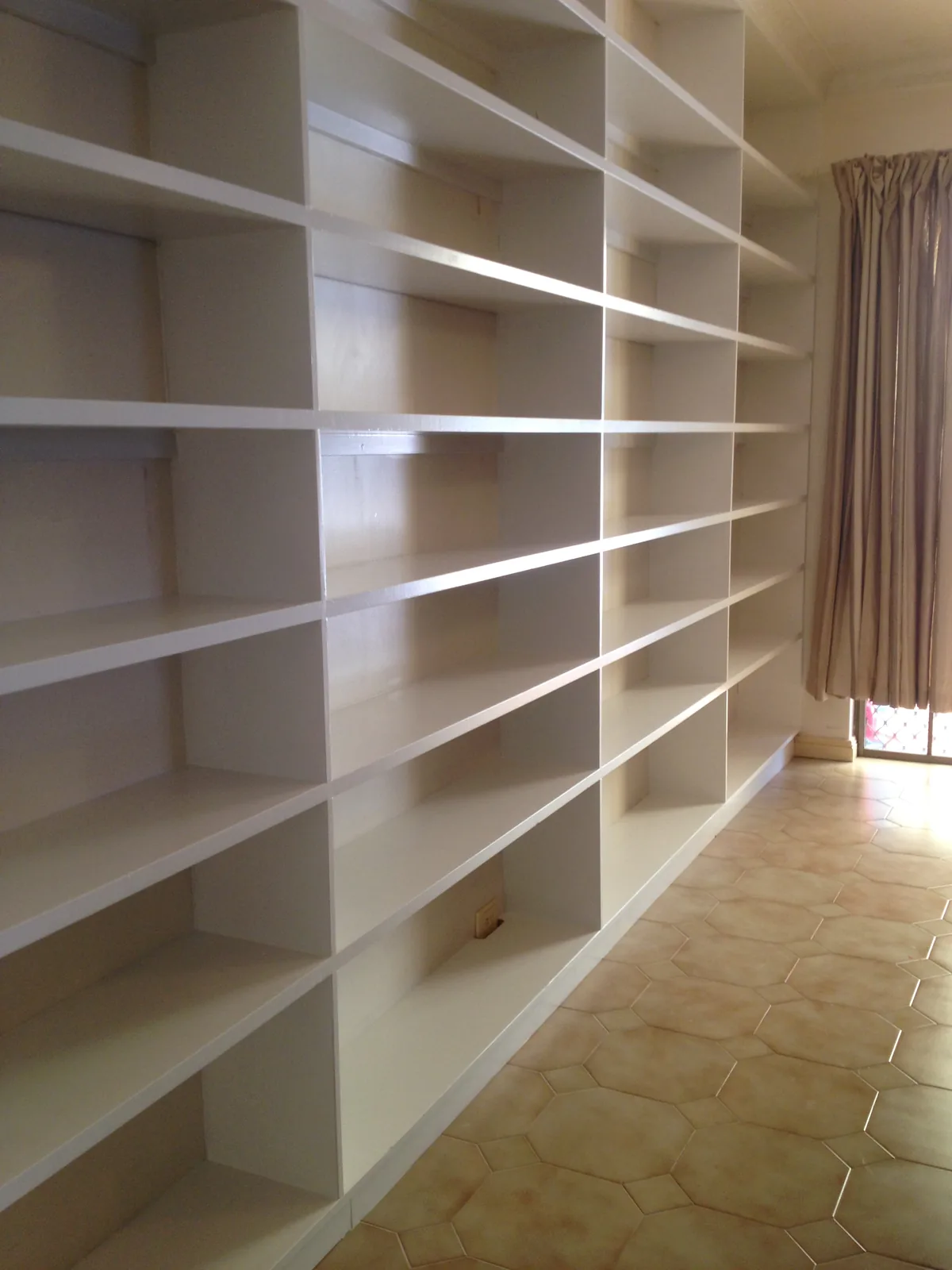 Custom white library shelving